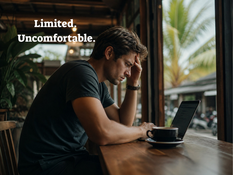 Digital nomad working uncomfortably on laptop without external monitor