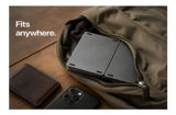 folded keyboard in a brown pauch pocket with 'Fits anywhere.' text.