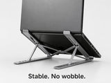 Laptop securely supported on stand with stable base and no wobble during use