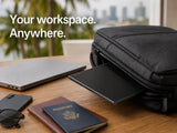 nomadscreen pro in backpack on a desk with laptop, phone, sunglasses, and passport.